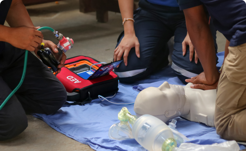 Emergency responders practicing CPR techniques