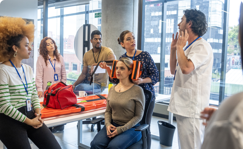 Group learning emergency medical procedures indoors